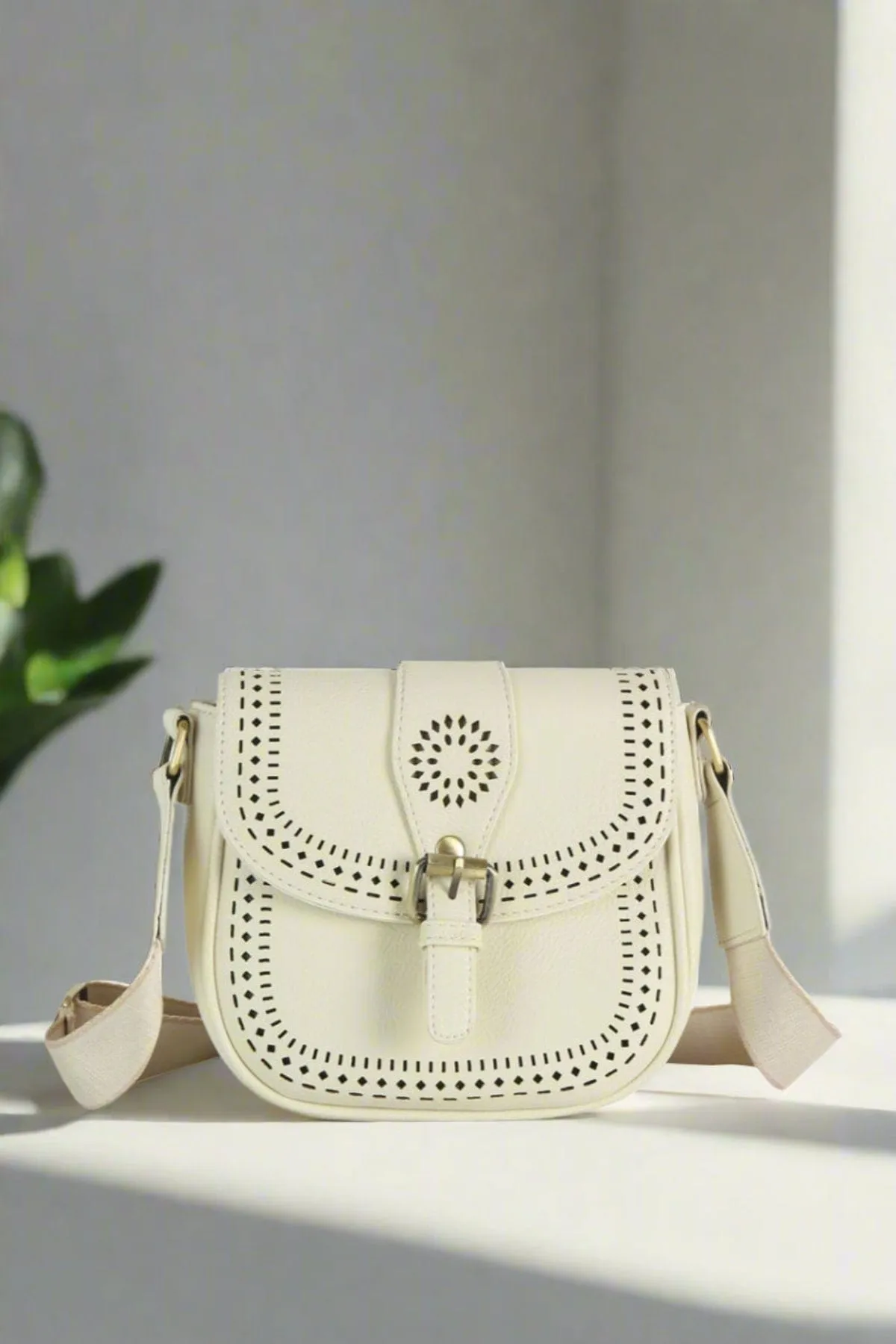 The perfect accessory for effortless style ME0050 Norah Laser Cutout Crossbody Bag