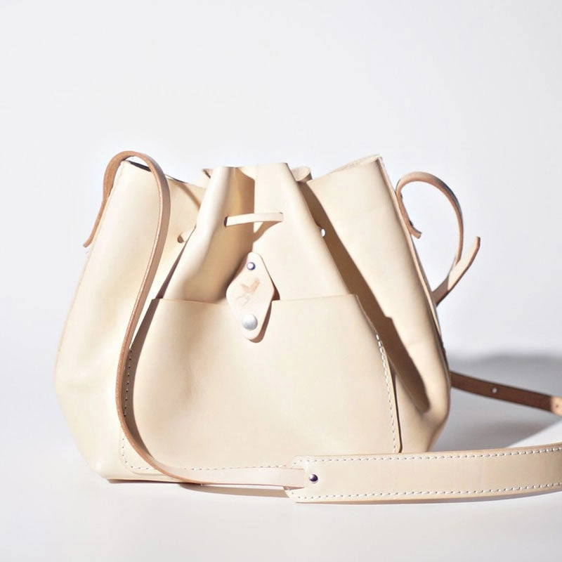 Simple Outfit Pairing Contemporary Lifestyle Handmade Beige Women Leather bucket crossbody bag Barrel shoulder bag for women